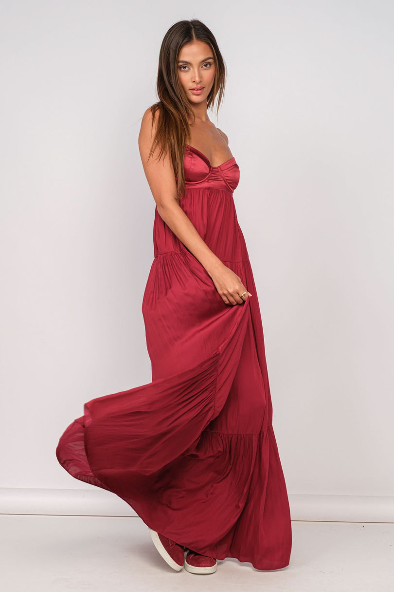 Blaire Burgundy Satin Tiered Maxi Dress styled as a wedding guest dress