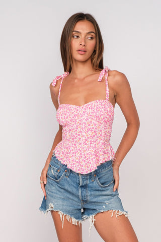 Elyse Pink Floral Peplum Top styled with distressed denim shorts