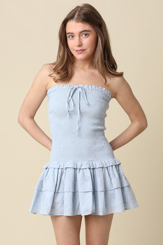 Front view of the Aimee light blue strapless eyelet mini dress with drop waist detail