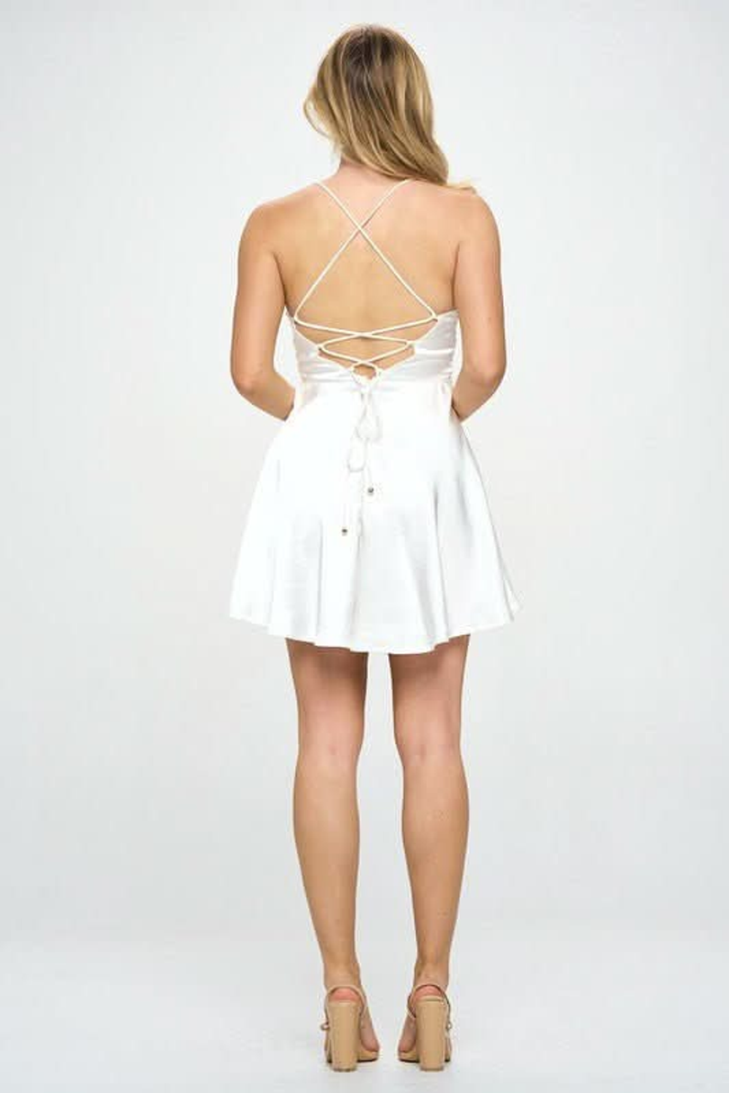 White satin mini dress with lace-up open back and flared skirt back view