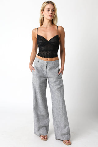 Ashtin Black Sheer Lace Crop Top stiled with striped linen pants and platform heels
