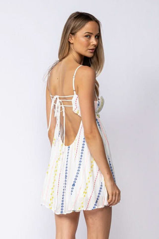 White embroidered babydoll mini dress with lace-up back detail