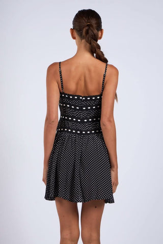 Summer polka dot cami dress with adjustable straps and flared skirt