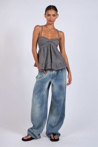 Gracie Black Gingham Babydoll Twist Top worn with barrel jeans and sandals