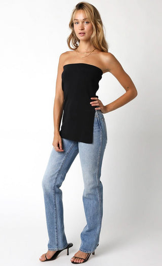 Model wearing the Lora Black Long Sweater Tube Top with kitten heels