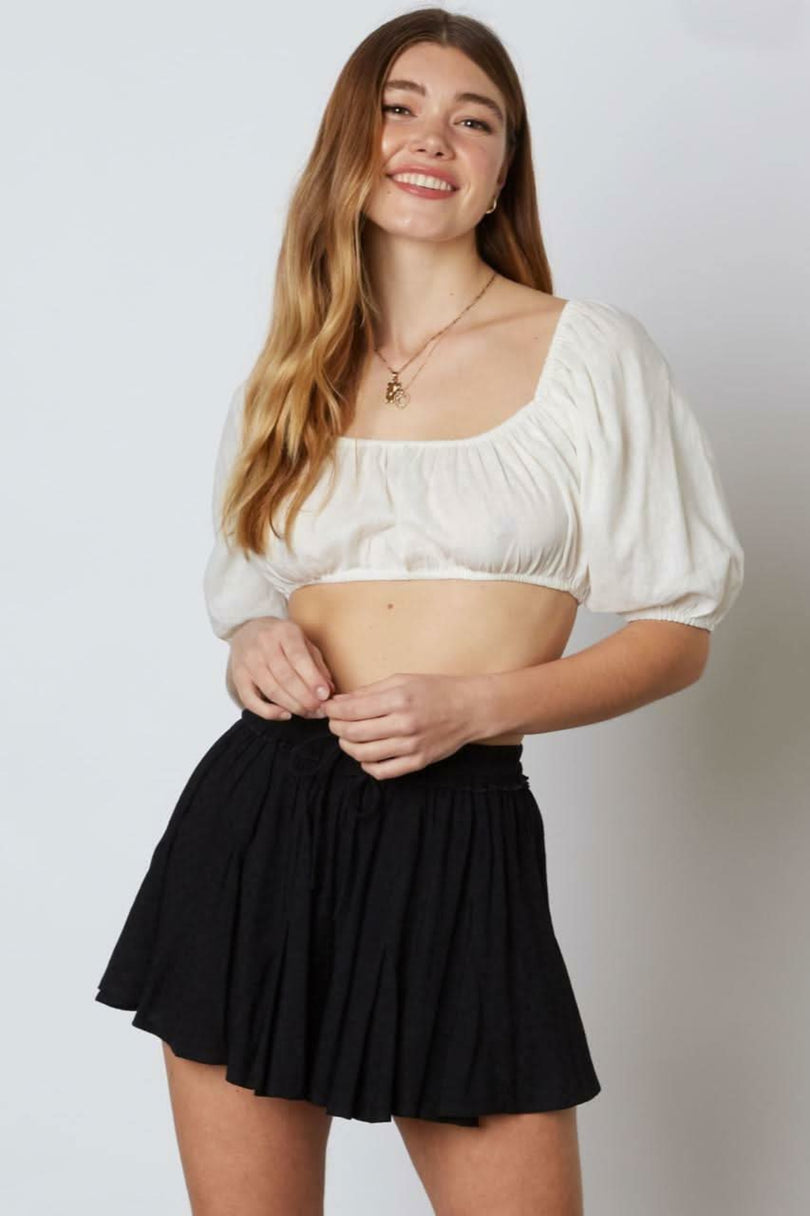 Black smocked flowy shorts front view
