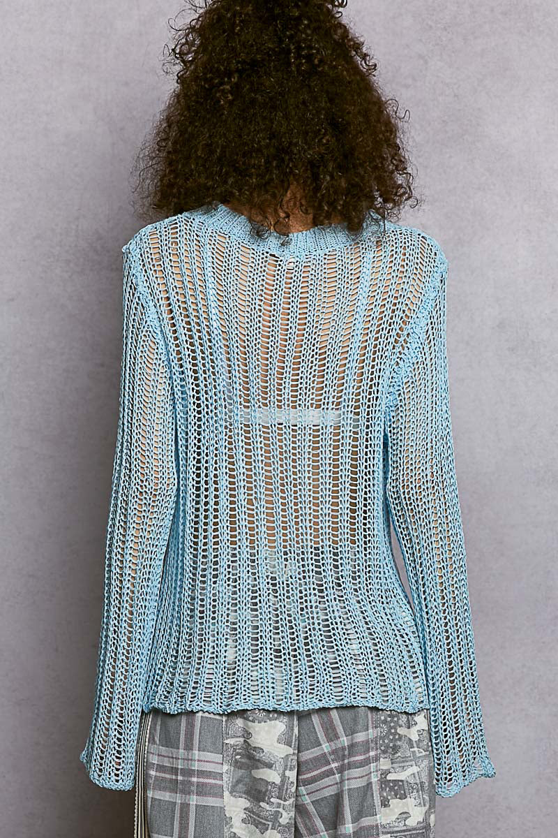 Back view of the Sola blue sheer sweater showing the drop shoulder