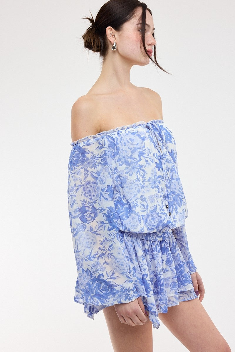 Side view of the blue and white floral chiffon skort dress showing the fitted drop waist and flared mini skirt
