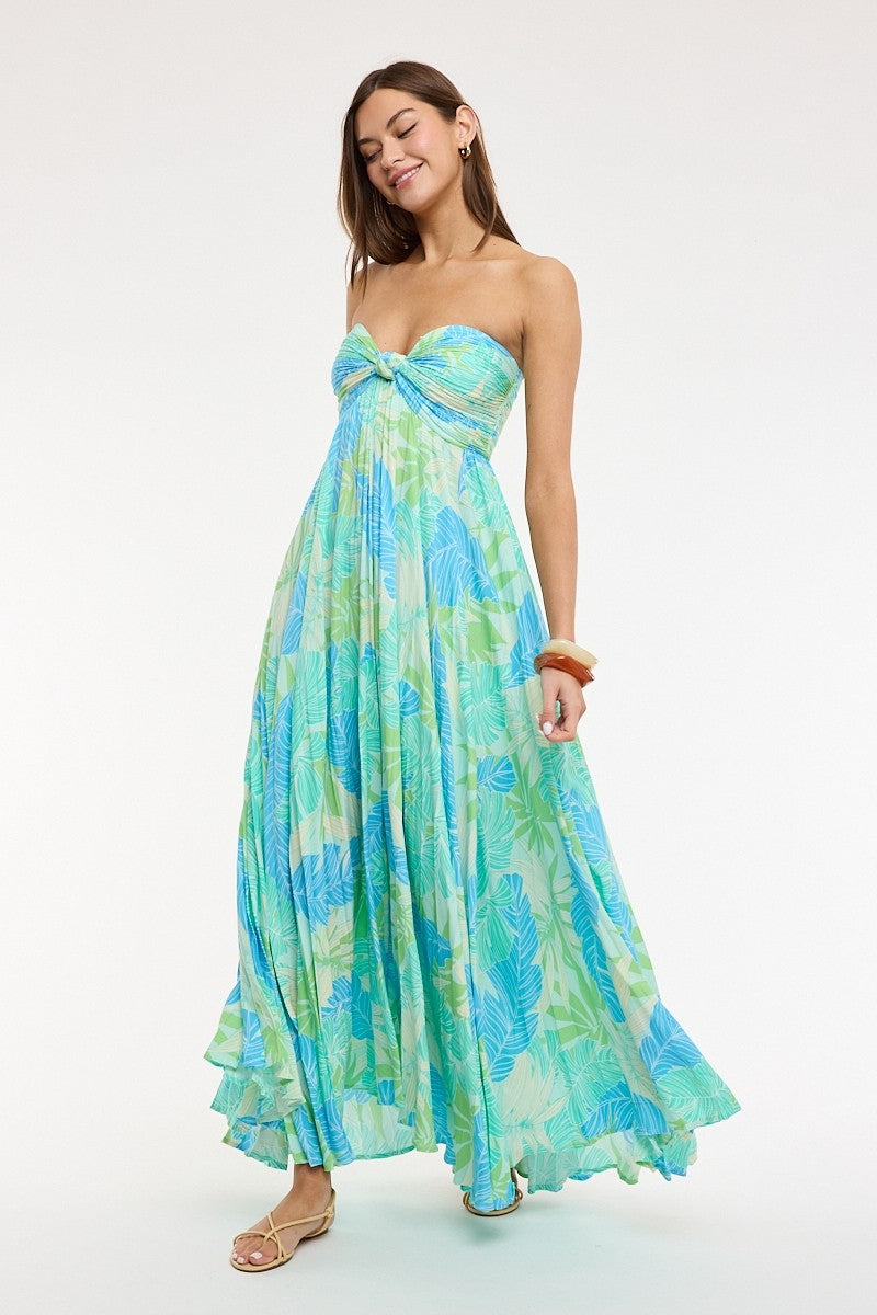 Detail of blue green tropical print fabric on strapless maxi dress