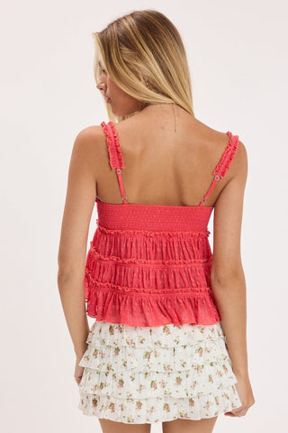 Back view of red babydoll top showing smocked bust and adjustable straps