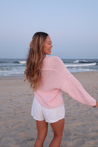 Brynn light pink slouchy V-neck sweater lifestyle back view