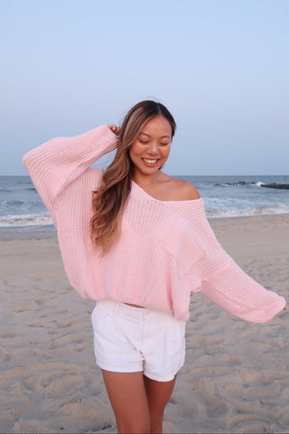 Brynn light pink V-neck sweater lifestyle front view