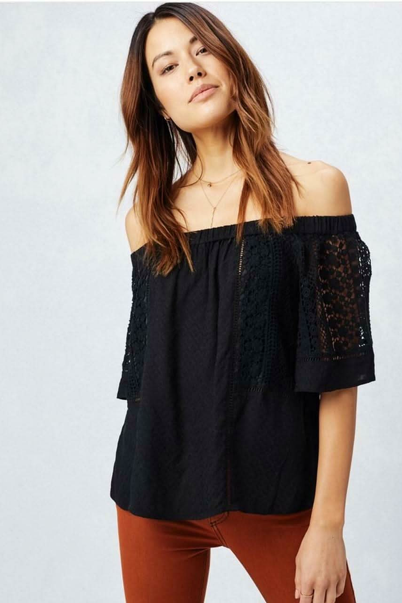 Black off the shoulder lace top with short sleeves and relaxed fit front view