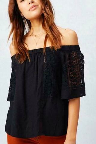 Black off the shoulder lace top styled with fitted pants full outfit