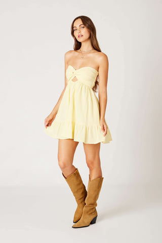 Butter yellow strapless romper dress styled with boots for a summer outfit | Boho Pink