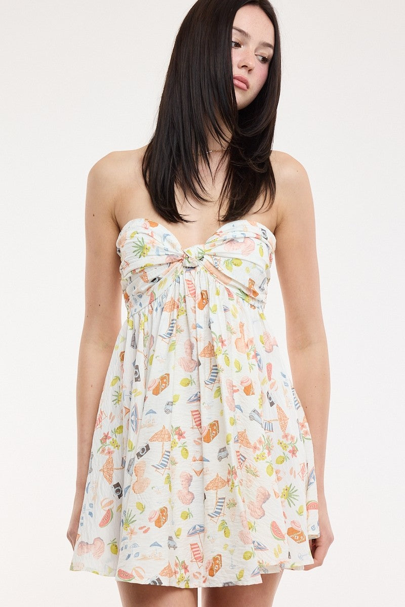 Colette White Vacation Print Strapless Babydoll Dress with a twisted knot sweetheart neckline