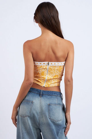 Back view of the Cora orange floral tube top showing the exposed silver zipper closure and fitted bodice