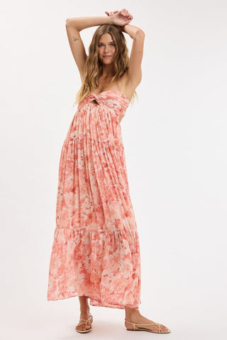 Coral floral strapless flowy maxi dress on model