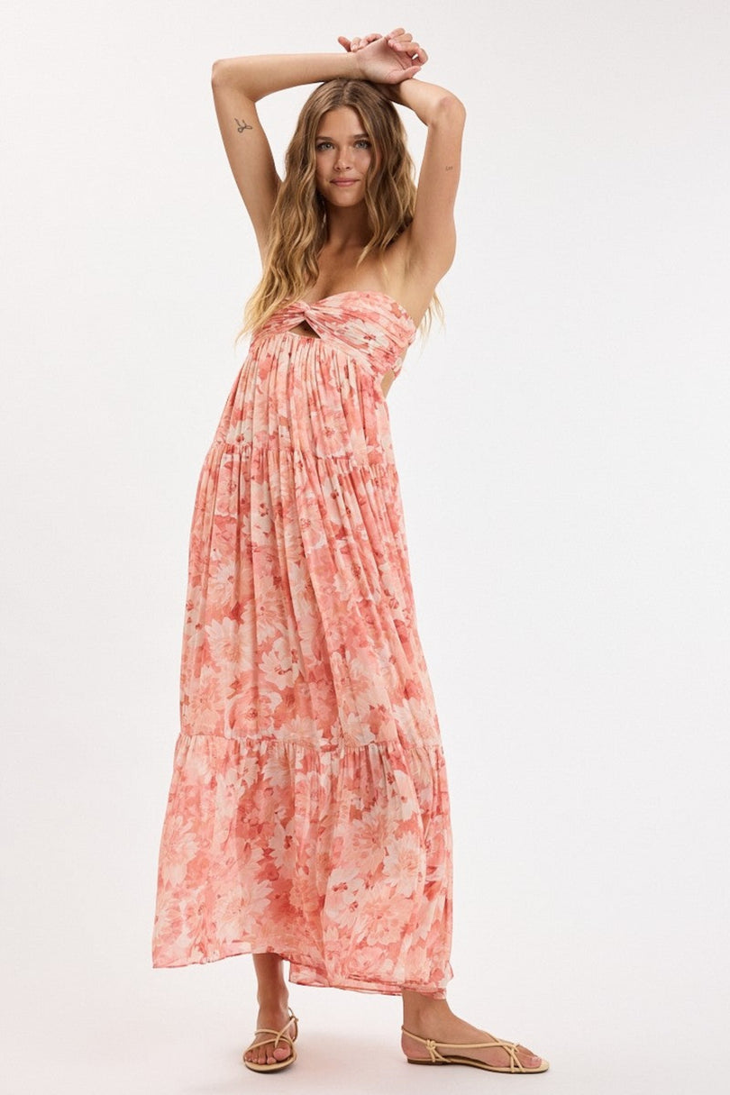 Coral floral strapless flowy maxi dress on model