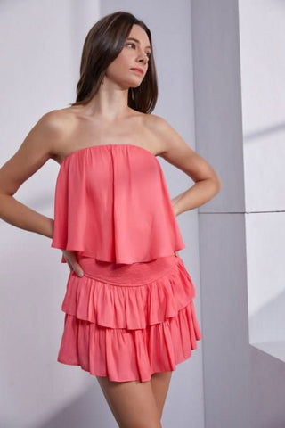 Coral strapless romper with ruffle overlay mini dress front view