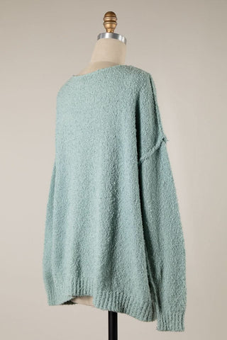 Back view of mint knit fabric on the Harlow V-neck pullover sweater.