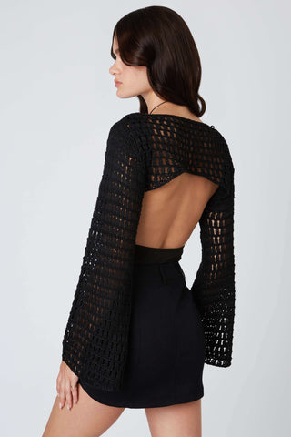 lightweight black crochet shrug layered over tank