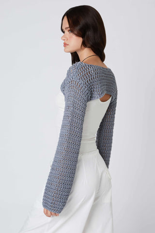 bolero style crochet shrug layered over tank