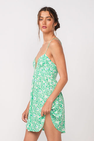 Woman wearing aqua green floral corset cami dress - side view