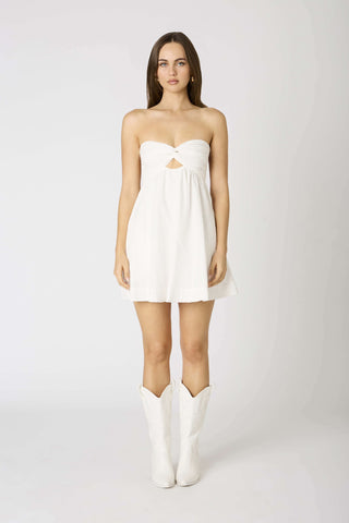 Side profile of white babydoll dress with flowy silhouette| Boho Pink
