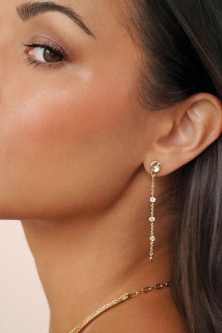 Ettika gold linear drop earrings side profile