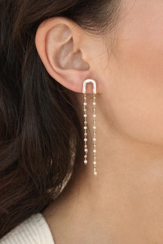 Ettika double chain pearl drop earrings on model