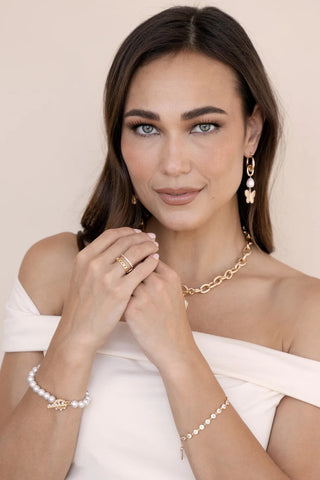Ettika gold crystal link bracelet styled on model