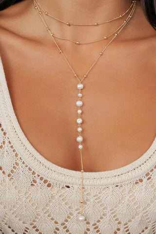 Close-up of the Ettika pearl lariat drop necklace