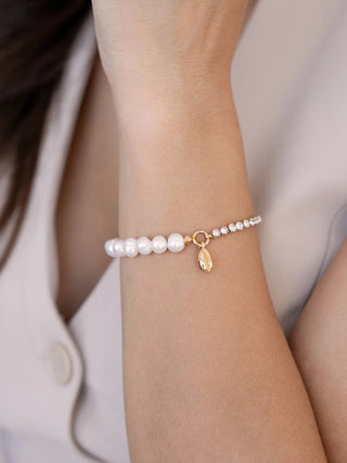 Ettika Pearl and Crystal Shell Bracelet close-up on model