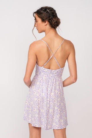 Back view of purple floral corset mini dress with delicate cami straps