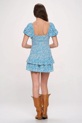 Blue floral boho mini dress with smocked waist and puff sleeves - back view