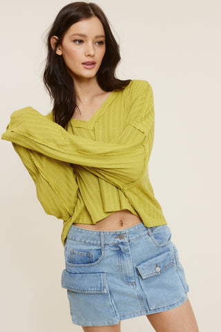 All The Way Green Long Sleeve Crop Top styled with a denim cargo mini skirt