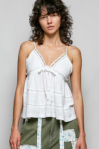 Main front view of the Kai White Babydoll Cami Top with colorful floral embroidery