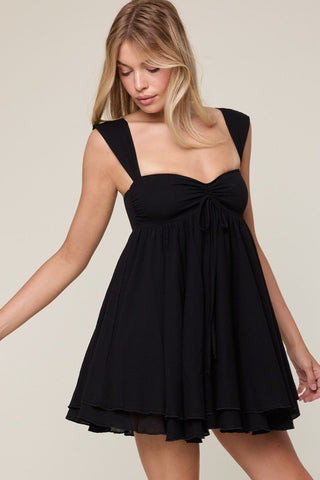 Black babydoll mini dress with sweetheart neckline