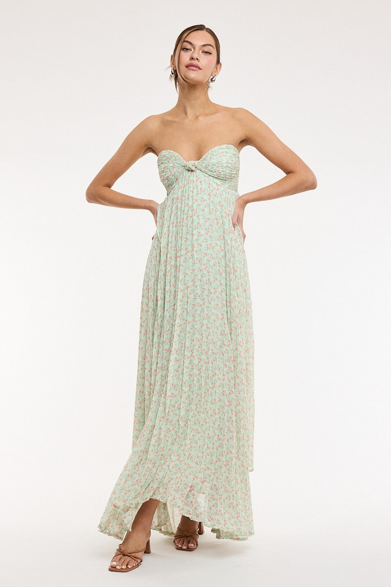 Close-up of ruched bodice on light green floral maxi dress