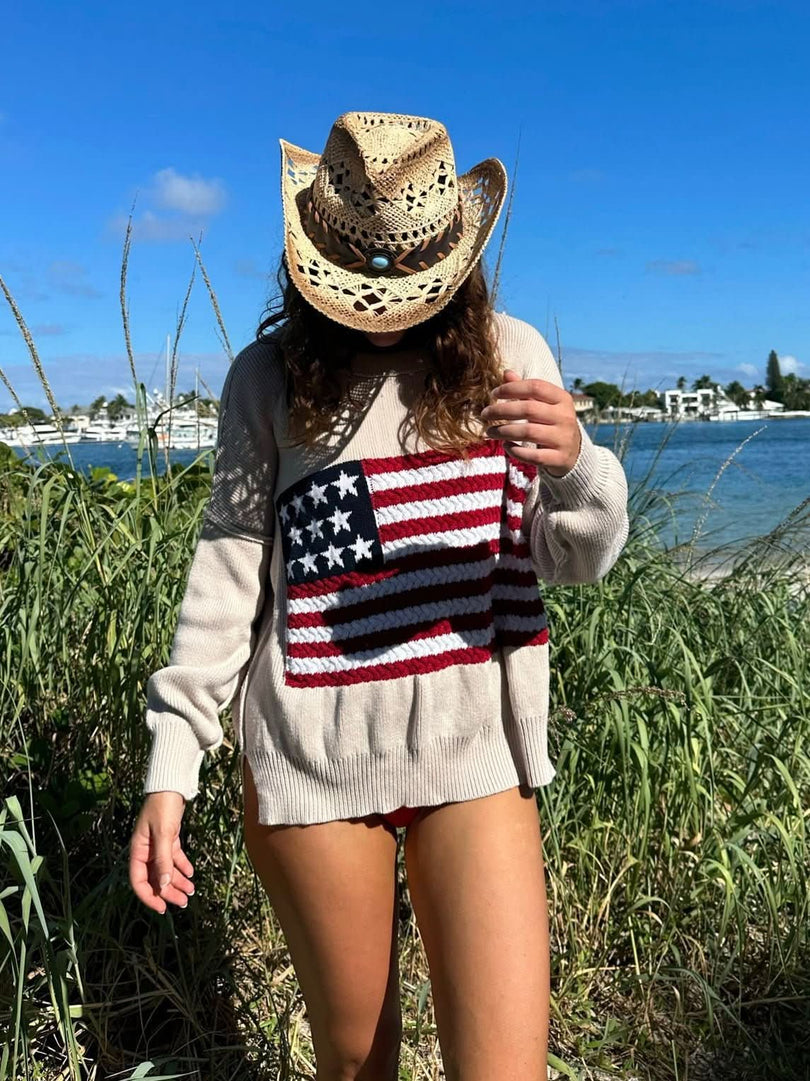 Land of Free Beige Oversized American Flag Sweater styled as a beach coverup