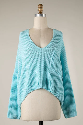 Front Patch Pocket Detail on Aqua Blue Oversized V-Neck Sweater | Boho Pink
