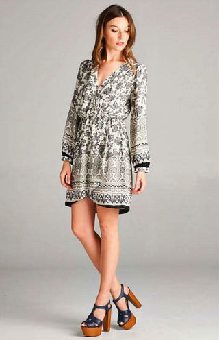 Long sleeve floral mini dress with a faux-wrap bodice and fitted waist