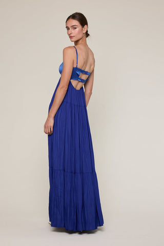 Model wearing blue formal tiered dress for special occasions like homecoming 
