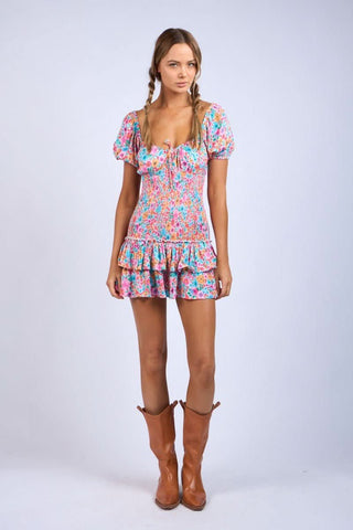 Aqua and pink floral mini dress styled with cowgirl boots for a country concert outfit