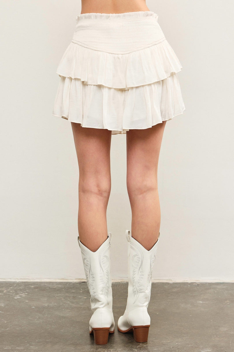 White tiered ruffle skort back view with flowy layers