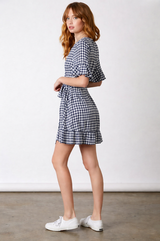 Navy and white gingham wrap mini dress side view