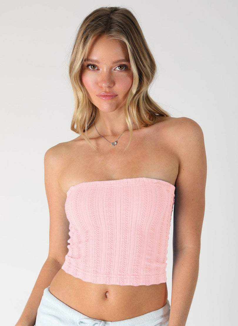Front view of NIKIBIKI Light Pink textured seamless strapless crop top on a model