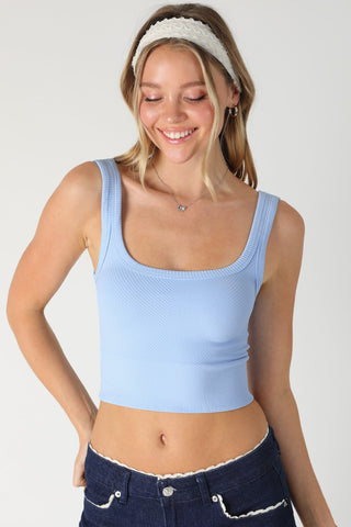 Front view of the NIKIBIKI Light Blue Cropped Chevron Tank featuring a square neckline and seamless cropped length