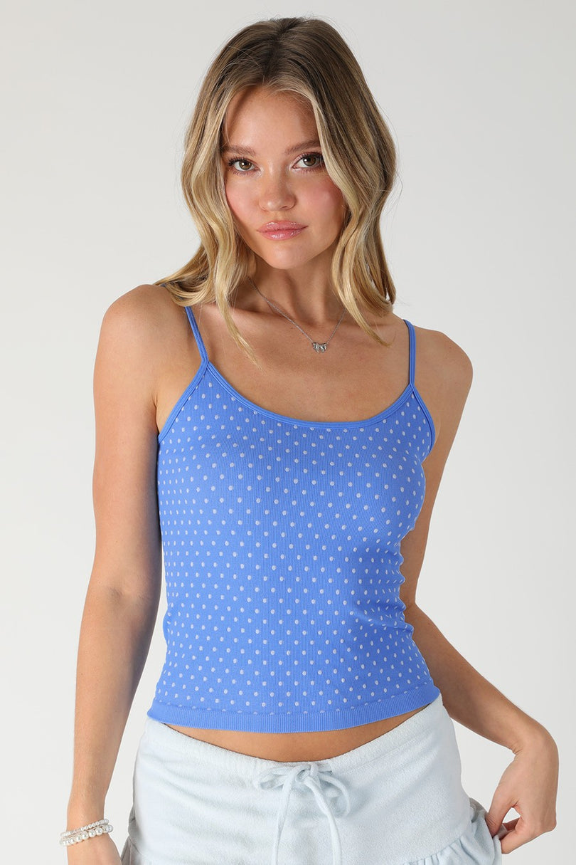 Front view of the NIKIBIKI Marina Blue Polka Dot Tank Top featuring white polka dots and a scoop neckline